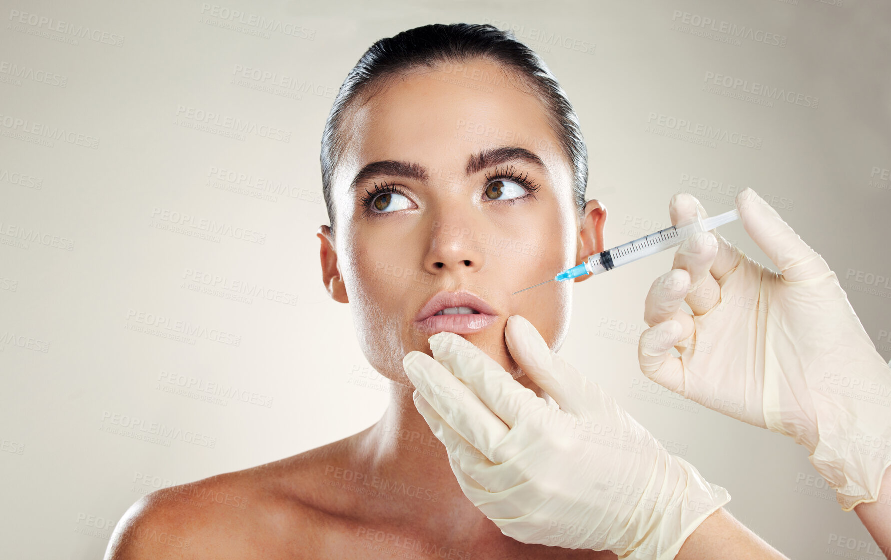 Buy stock photo Skincare, aesthetic beauty and woman with injection in lips from healthcare professional, anti aging treatment in studio. Collagen, mouth and model with facial lip filler syringe on white background.
