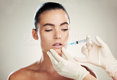 Buy stock photo Skincare, collagen and aesthetic beauty, woman with injection in lips and treatment from healthcare professional.  Mouth, needle and model with facial lip filler syringe on white background in studio