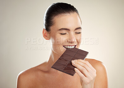 Buy stock photo Beauty, eating and face of woman with chocolate bar, junk food or dessert for sugar sweets, candy snack or cheat meal. Cosmetics makeup, skincare and hungry model with cacao product for antioxidants