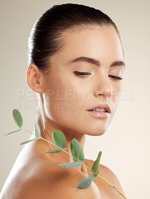 Buy stock photo Skincare, woman and beauty with natural plant on skin for green dermatology for cosmetic product. Glow on face of aesthetic model in studio for sustainable cosmetics or makeup for health and wellness