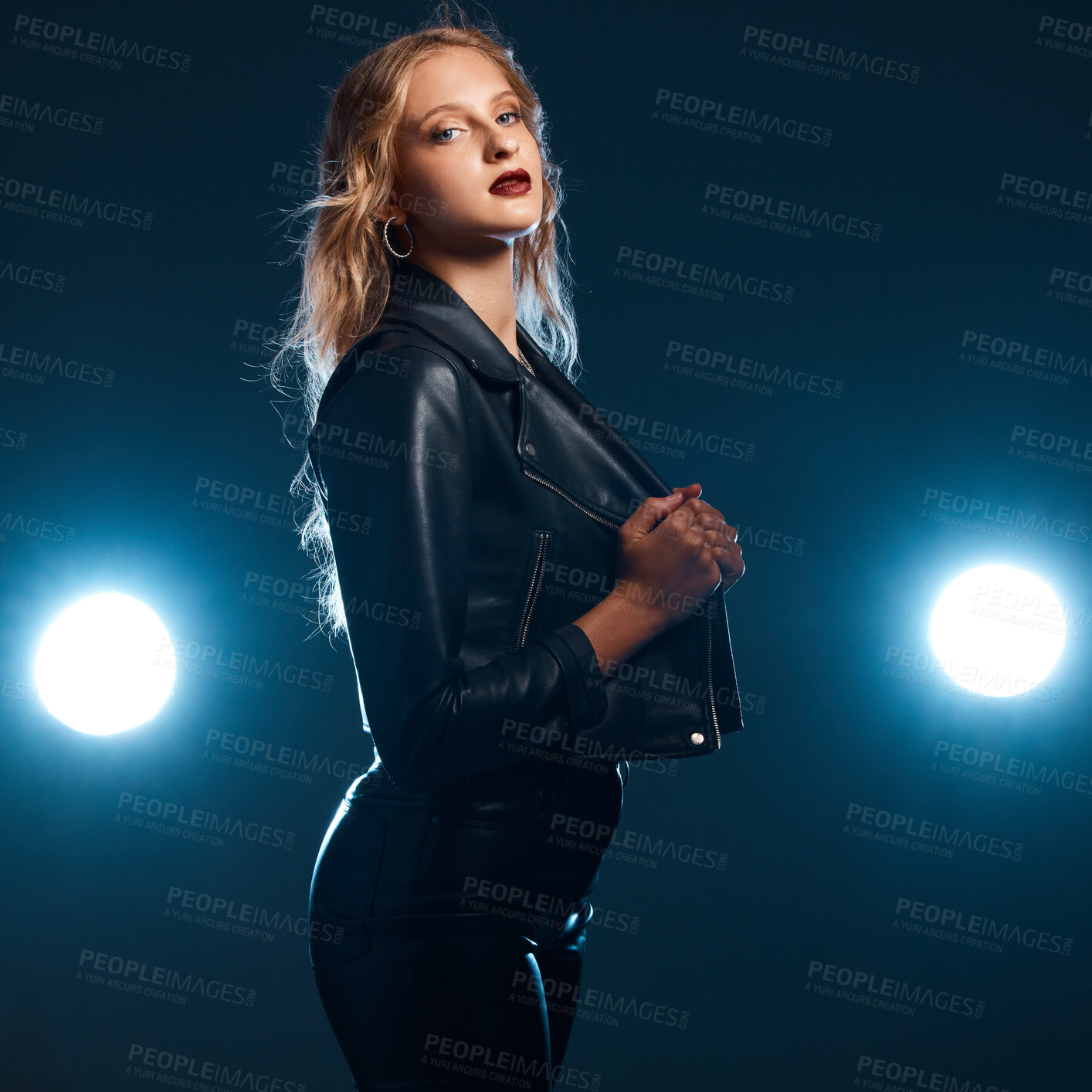 Buy stock photo Leather, dance performance and woman portrait of isolated dancer or singer with stage lights. Dark background, studio and theatre presentation of a young female ready for creative dancing with light