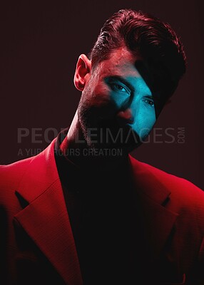 Buy stock photo Art, neon light and reflection, portrait of man with eyes in lighting on serious face and self expression. Futuristic fashion, male model and beauty with red and blue studio lights on dark background