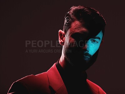 Buy stock photo Art, light and reflection, portrait of man with eye in lighting, serious face and mockup space. Futuristic fashion, male model and beauty, red and blue creative studio neon lights on dark background.