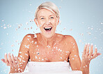 Shower, face and old woman excited with water drops, clean skin and antiaging skincare, elderly model isolated on studio background. Beauty, senior cosmetic care and facial portrait, wow and hygiene