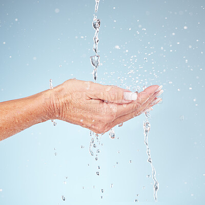 Buy stock photo Senior hands, water splash for clean hygiene, fresh sustainability or wash against studio background. Hand of elderly holding natural liquid drops for skin hydration, wellness or safety from bacteria