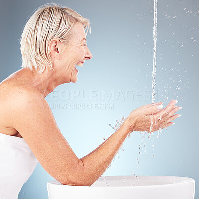 Buy stock photo Senior woman, water splash and washing hands for  wellness, beauty and skincare health on studio background. Happy model, cleaning drops and body in bathroom of facial aesthetic, shower and self care