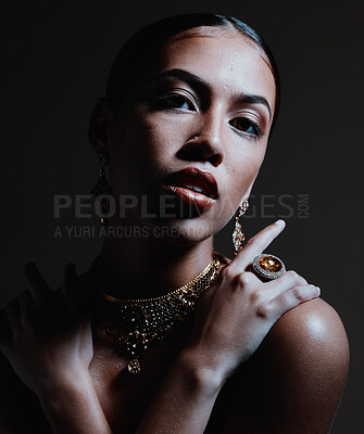 Buy stock photo Woman, beauty and jewelry in stylish fashion for rich wealth, luxury or cosmetics against a dark studio background. Portrait of beautiful attractive female wearing makeup, diamond ring and necklace