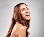 Happy, portrait and woman in studio for hair, beauty and  salon treatment on grey background. Face, haircare and model laughing for luxury, hair care and shine, keratin and smooth results isolated