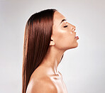 Hair, beauty salon and luxury woman haircut of a person with brazilian treatment in a studio. Gray background, isolated and natural healthy keratin shampoo of a model style shine after hairdresser 