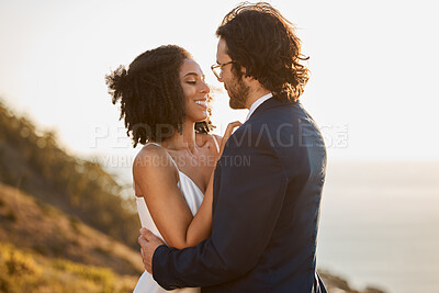 Buy stock photo Love, wedding and bride with groom on mountain for marriage ceremony, commitment and celebration. Romance, happiness and interracial couple bonding, hug and smile with ocean, nature and outdoors