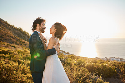 Buy stock photo Wedding, love and couple on mountain for marriage ceremony, commitment and celebration. Romance, happiness and interracial bride and groom bonding, share intimate moment and smile by ocean in Italy