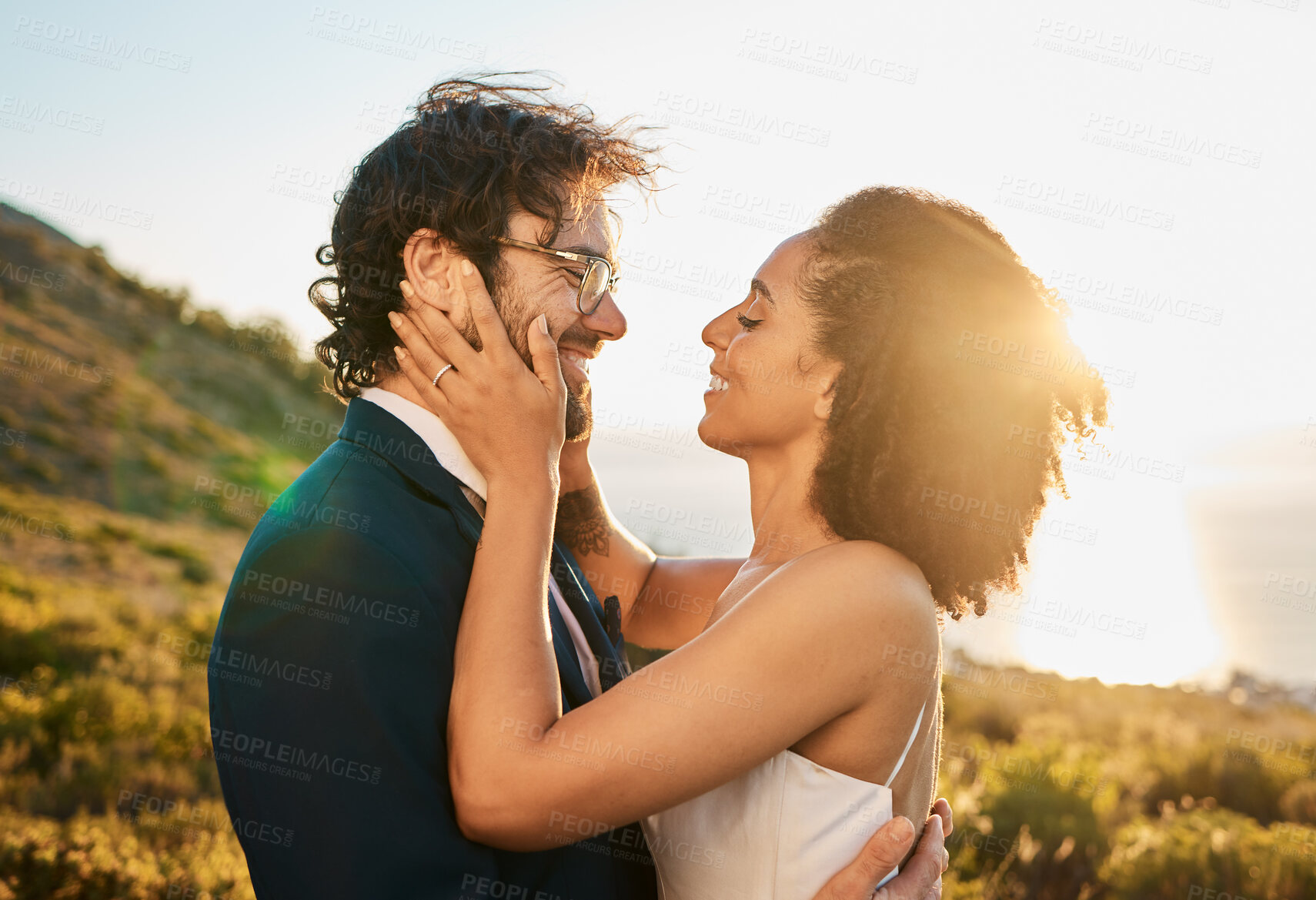 Buy stock photo Love, wedding and couple on mountain kiss for marriage ceremony, commitment and celebration. Affection, romance and interracial bride and groom bonding, happy and smile with ocean sunset in Italy