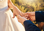 Couple hands, wedding ring and love ceremony outdoor with jewelry and save the date announcement. Engagement, together and marriage of people in nature at commitment and engagement event with faith