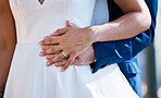 Hands, married and interracial wedding of couple for outdoor celebration of partnership, care and love. Marriage commitment and support of bride with groom at event with embrace for togetherness.