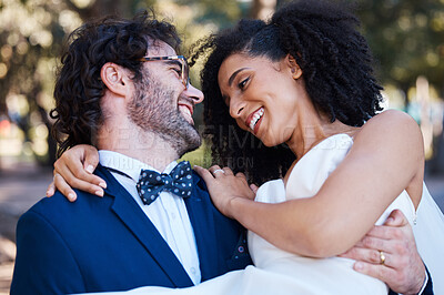 Buy stock photo Happy couple, wedding and carrying bride outdoor at marriage celebration event with love. Interracial man carries woman in arms at park for care, partnership and support with a smile while walking