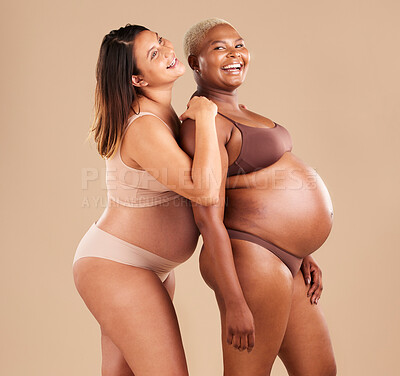 Buy stock photo Pregnant, bonding or laughing women on studio background in body empowerment, support or community. Happy smile, diverse or pregnancy friends in underwear and fun joke, baby or family planning mockup