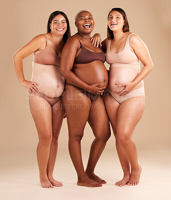 Buy stock photo Pregnant body, portrait or laughing women on studio background in diversity empowerment, baby support and community. Smile, happy or pregnancy friends in underwear with stomach in funny or comic joke