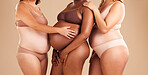 Pregnant body, bonding or women and stomach touch, support or community diversity on studio background. Pregnancy, friends or mothers in underwear for tummy growth, empowerment or healthcare wellness