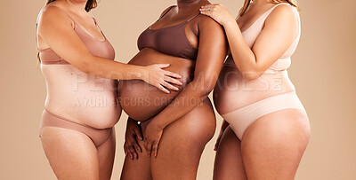 Buy stock photo Pregnant body, bonding or women and stomach touch, support or community diversity on studio background. Pregnancy, friends or mothers in underwear for tummy growth, empowerment or healthcare wellness