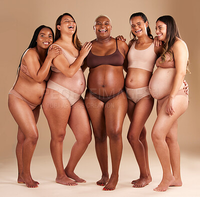 Pregnant, body and laughing group of women in diversity support, solidarity  and community on studio background. Smile, happy or pregnancy friends in  underwear, funny or comic joke with stomach growth