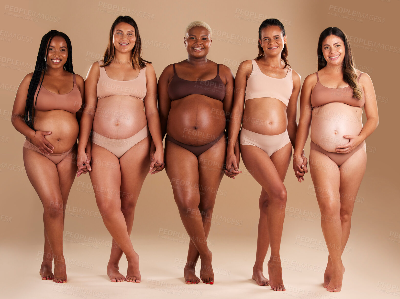 Buy stock photo Pregnant, women or diversity portrait with stomach on studio background in body love, baby or community support. Smile, happy or pregnancy friends in underwear for tummy growth or mothers empowerment