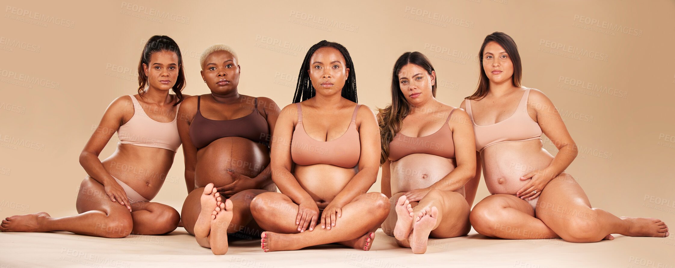 Buy stock photo Pregnant, portrait and sitting women in underwear for community bonding, diversity support or body empowerment. Floor, pregnancy or friends in healthcare wellness, strong mindset or mothers day pride