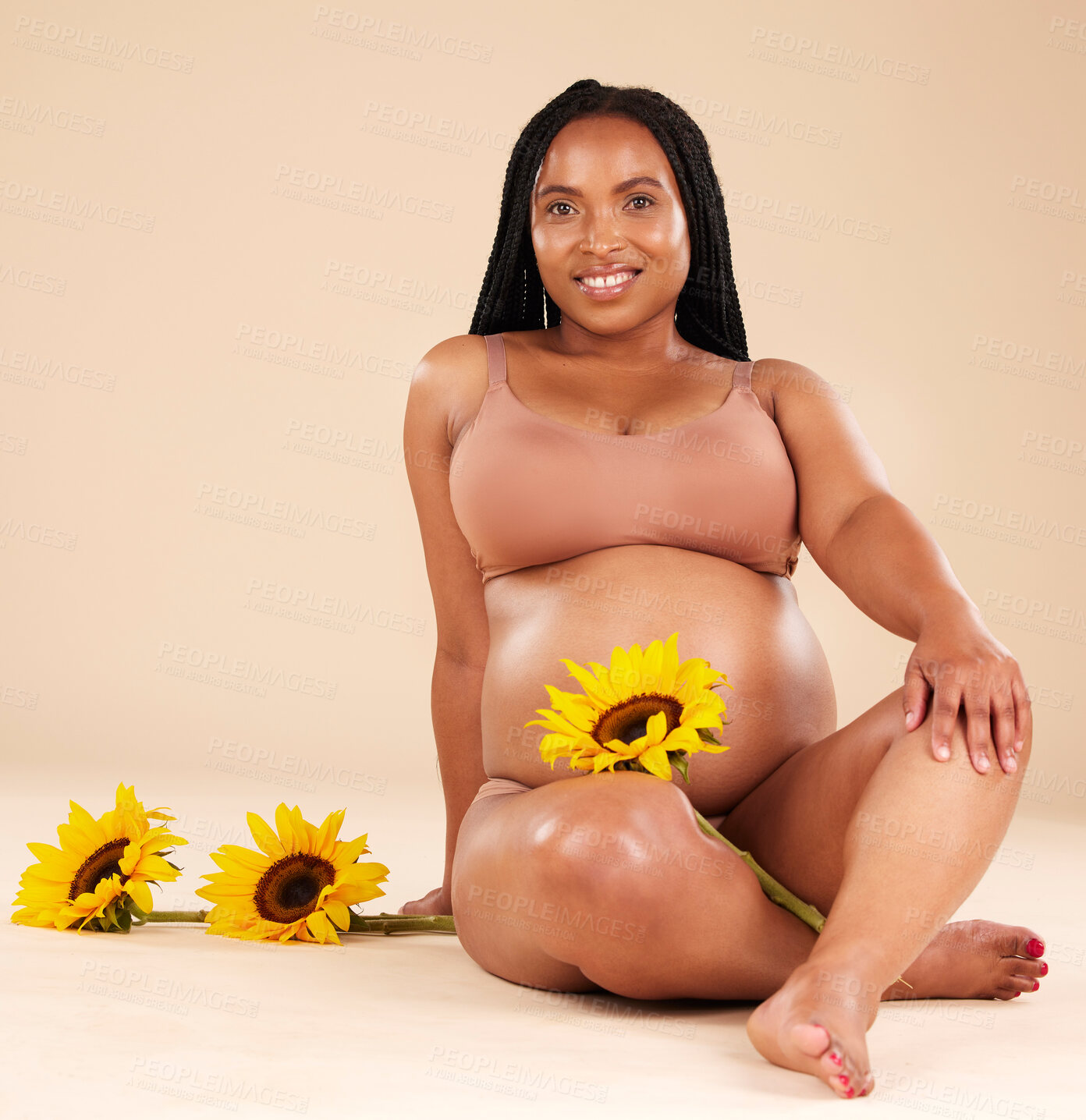 Buy stock photo Black woman sitting with flower, pregnant with smile in portrait and beauty, skincare isolated on studio background. Pregnancy glow, mother and nature with natural cosmetic care, health and wellness