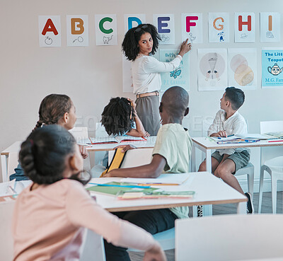 Buy stock photo Teacher, woman and school classroom with kids learning the alphabet and answer a question. Assessment, learners and tutor teaching information for child development in a class for education