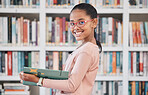 Books, education or girl reading in library for knowledge or development for future growth. Scholarship, portrait or school student with a happy smile studying or learning information in a fun story