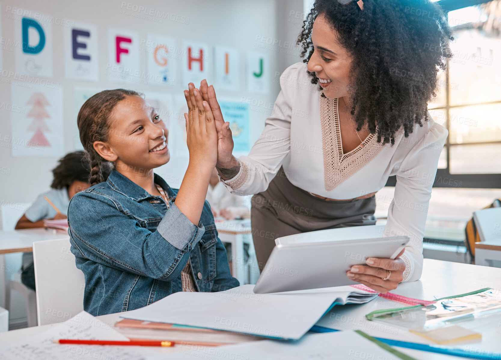 Buy stock photo Tablet, high five and teacher with child education, learning and support, achievement and classroom goal. Mentor, black woman or person and girl in success hand sign for English, language development