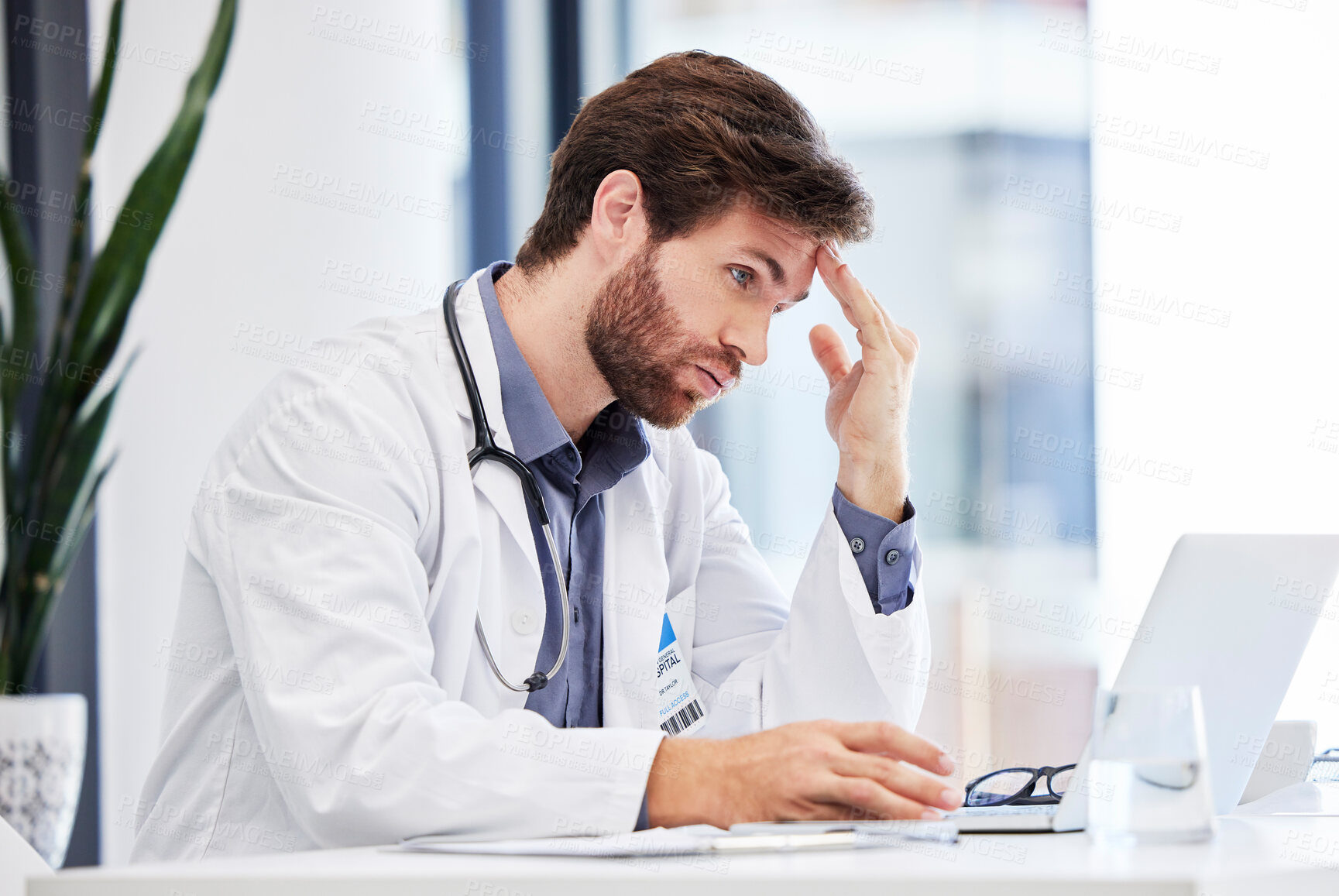 Buy stock photo Headache, stress and anxiety of doctor on laptop reading hospital data, results and news fail, mistake or error. Tired, burnout or depression of medical professional with mental health research on pc