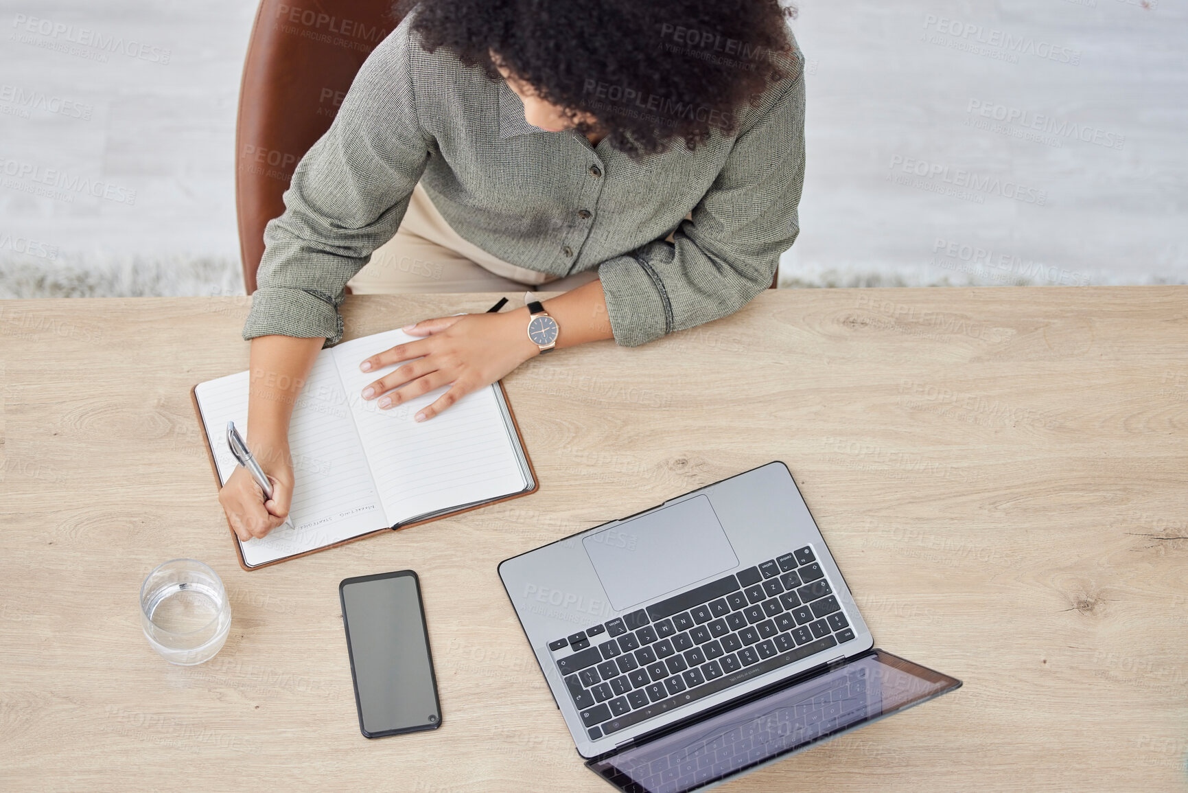 Buy stock photo Laptop, writing and notebook with a business black woman at work on a schedule in her office from above. Computer, research and overhead with a female employee planning while working at a desk