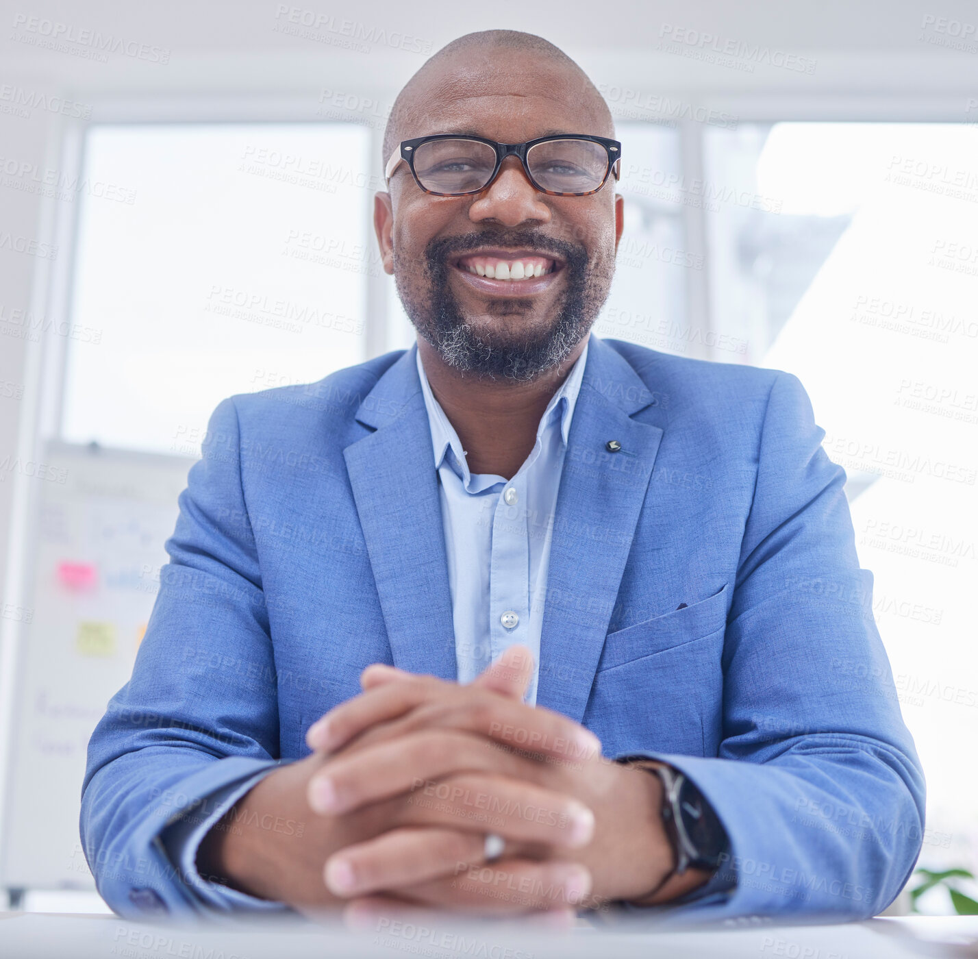 Buy stock photo Businessman, CEO and portrait smile for management, leadership or corporate executive sitting by office desk. Happy African American male manager smiling for entrepreneurship, sales or investment