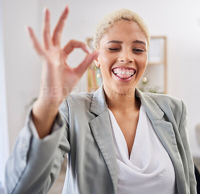 Buy stock photo Portrait, tongue and emoji with a business black woman winking in her office at work to gesture a perfect hand sign. Face, motivation and succes with a female employee feeling happy or proud