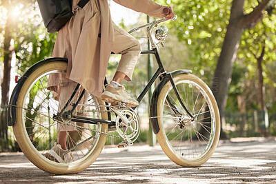 Buy stock photo Bicycle, closeup and feet of casual cyclist travel on a bike in a park outdoors in nature for a ride or commuting. Exercise, wellness and lifestyle student cycling as sustainable transport