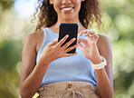 Phone, social media and woman online texting on the internet, web or app outdoors in a park. Closeup, mobile and surfing on a website by a happy person connecting due digital communication