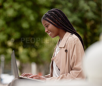 Buy stock photo Business, city and black woman typing on laptop in street, social media or internet browsing. Remote worker, computer and happy female employee working on research, email or project in town outdoors.