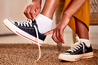 Buy stock photo Hands, shoes and lace getting ready for walk, travel or shopping on the carpet floor or mat at home. Hand of person tying laces, fitting or putting on shoe in preparation for walking, journey or trip