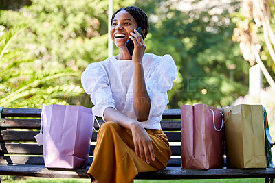 Buy stock photo Phone call, happy or black woman with shopping, luxury sale or retail bags in Paris park with smile. 5g network, fashion or girl with smartphone for comic communication or networking in city bench
