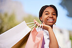 Black woman, shopping and bags for luxury, thinking and purchase in city, smile and customer. African American female client, lady and shopper with boutique clothes, expensive brands and outdoor