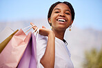 Shopping, black woman and portrait outdoor with retail bags after sale and sales promotion. Happy, smile and excited young person in nature feeling freedom after market deal and fashion mall discount