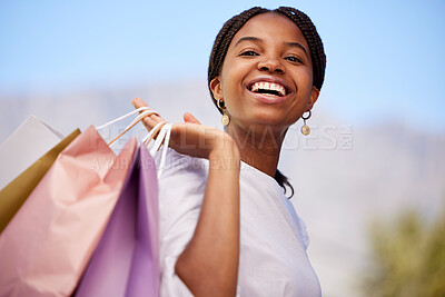 Buy stock photo Shopping, black woman and portrait outdoor with retail bags after sale and sales promotion. Happy, smile and excited young person in nature feeling freedom after market deal and fashion mall discount