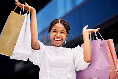 Buy stock photo Portrait, shopping and an excited black woman customer carrying bags in a mall for retail or consumerism. Sale, product and fashion with a young female consumer or shopping buying from a store