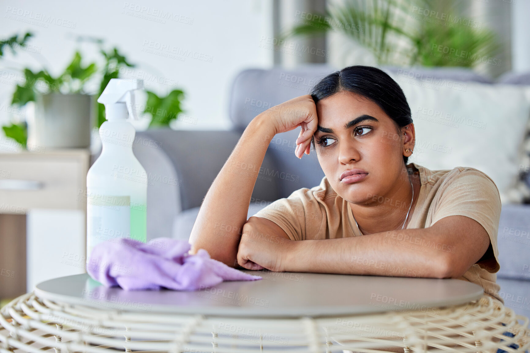 Buy stock photo Cleaning, tired and bored with a woman in the living room of her home for hygiene or housework.Depression, burnout and housekeeping with a frustrated female cleaner in an apartment domestic work