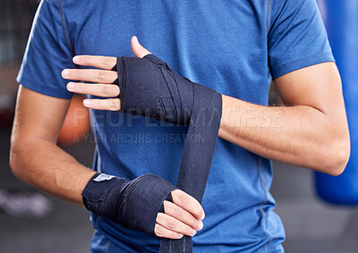 Buy stock photo Fitness, boxing and tape with hands of man in gym for sport, workout and martial arts training. Exercise, strong and wellness with boxer and wrap bandage in mma class for fight, health or performance