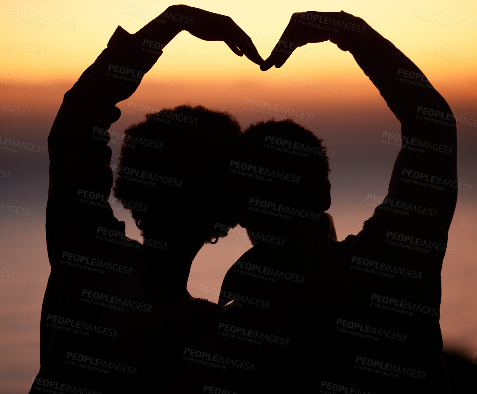 Buy stock photo Sunset, heart and silhouette of couple at beach enjoying romantic vacation, holiday and honeymoon adventure. Emoji, travel and shadow of people relax, calm and together for trust, commitment and love