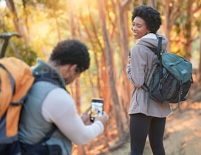 Buy stock photo Forest, phone photography or black couple hiking in nature for exercise, workout or training on holiday. Travel, pictures or African partners trekking or walking to hill on a fun outdoor adventure