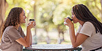 Woman, friends and drinking coffee at cafe for conversation, social life or communication outside. Happy women enjoying friendly discussion, talk or gossip together in friendship at coffee shop