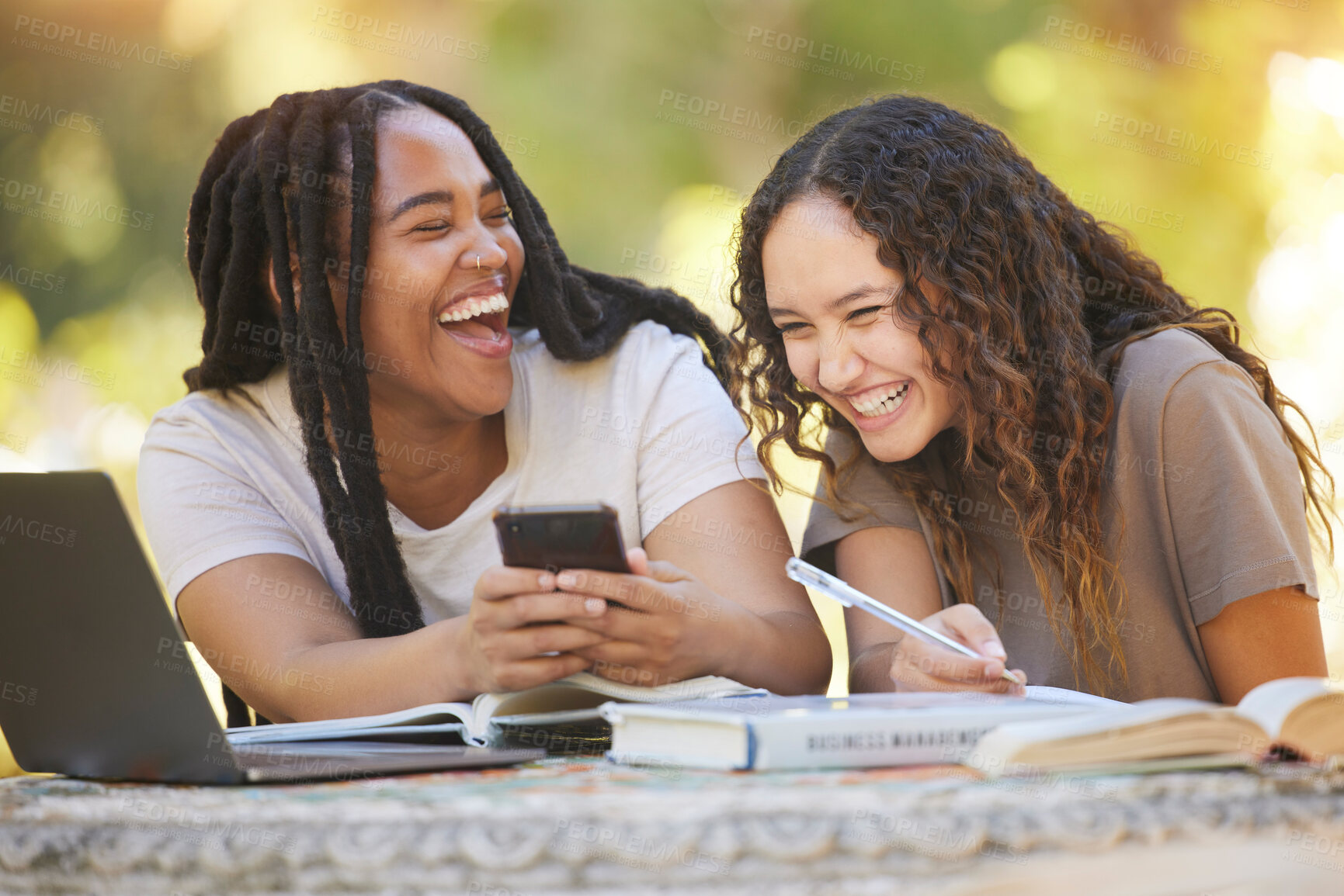 Buy stock photo Students, friends and women with phone at park laughing at funny meme. University scholarship, comic and happy girls or females with mobile smartphone laugh at joke or crazy comedy on social media.