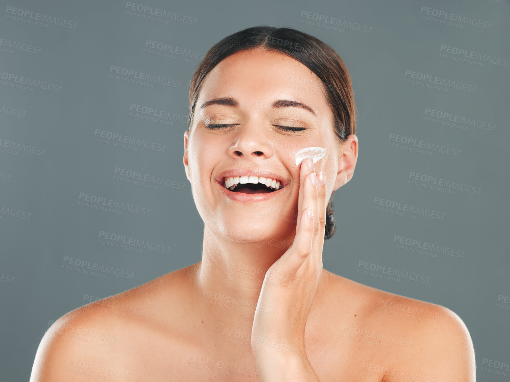 Buy stock photo Skincare, beauty cream and woman with happiness from sunscreen and self care in studio. Wellness, spa and smile of a model laugh with collagen lotion with studio background and dermatology treatment